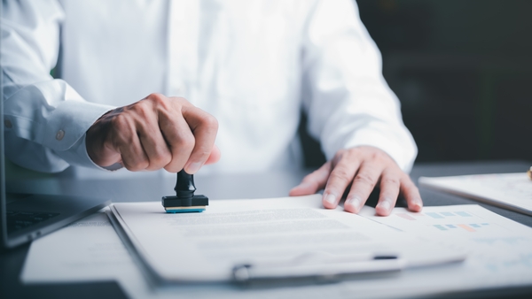 Businessman,Validates,And,Manages,Business,Documents,And,Agreements,,Signing,A